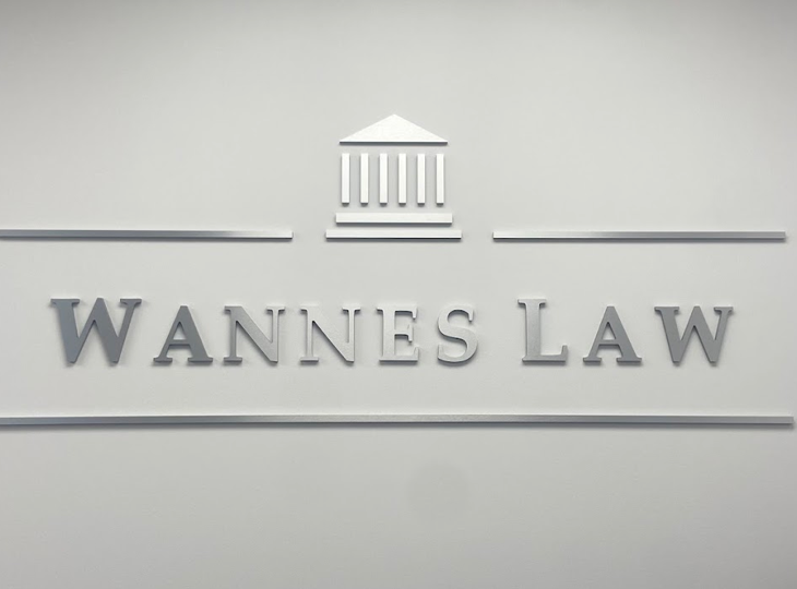 The Wannes Law sign on the office wall